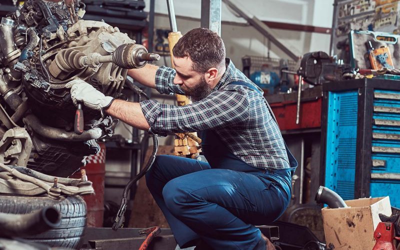 brutal-tattooed-mechanic-repairs-the-car-engine-in-small-ot6kuz5sxd9ona5acpsb751w7f9ri6d4xpgwaxs0p4